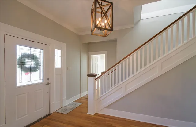 a view of an entryway with wooden floor