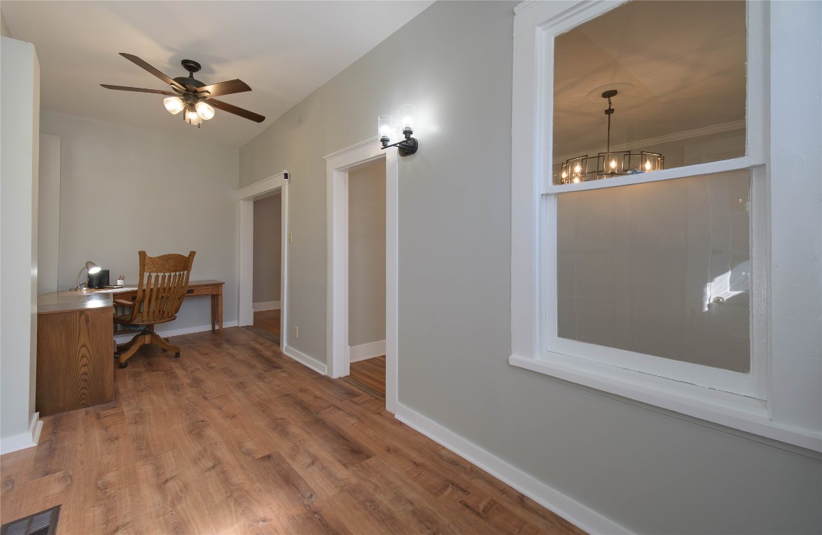 307 Walnut Drive East Austin, TX 78753 - Photo 10 of 34 a view of a livingroom with a chair and a ceiling fan