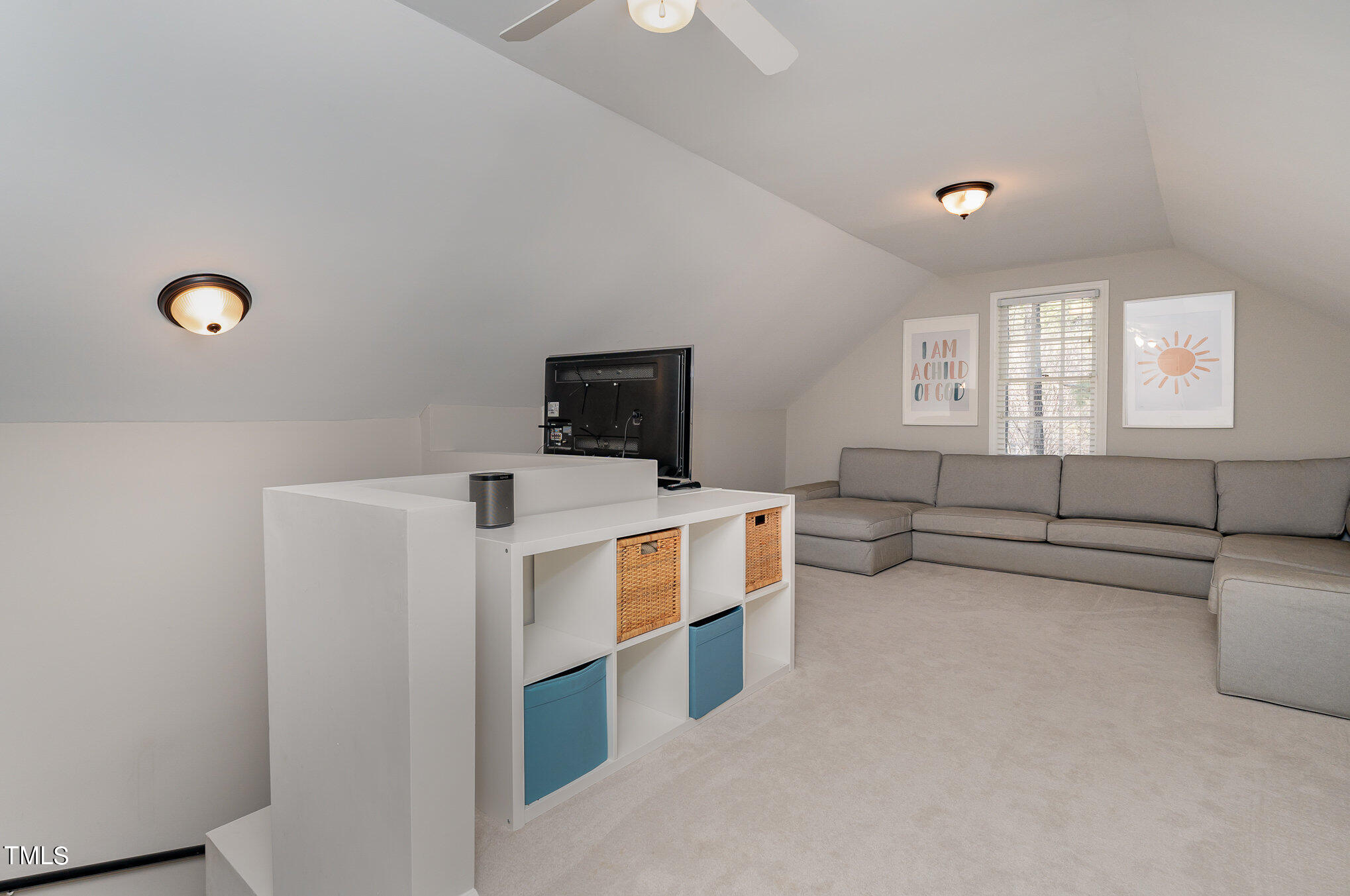 2500 Harptree Court Raleigh, NC 27613 - Photo 30 of 44 a living room with furniture and a flat screen tv