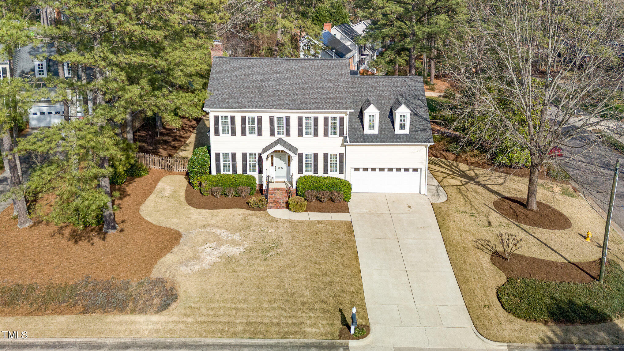 2500 Harptree Court Raleigh, NC 27613 - Photo 36 of 44 a view of a white house with large trees