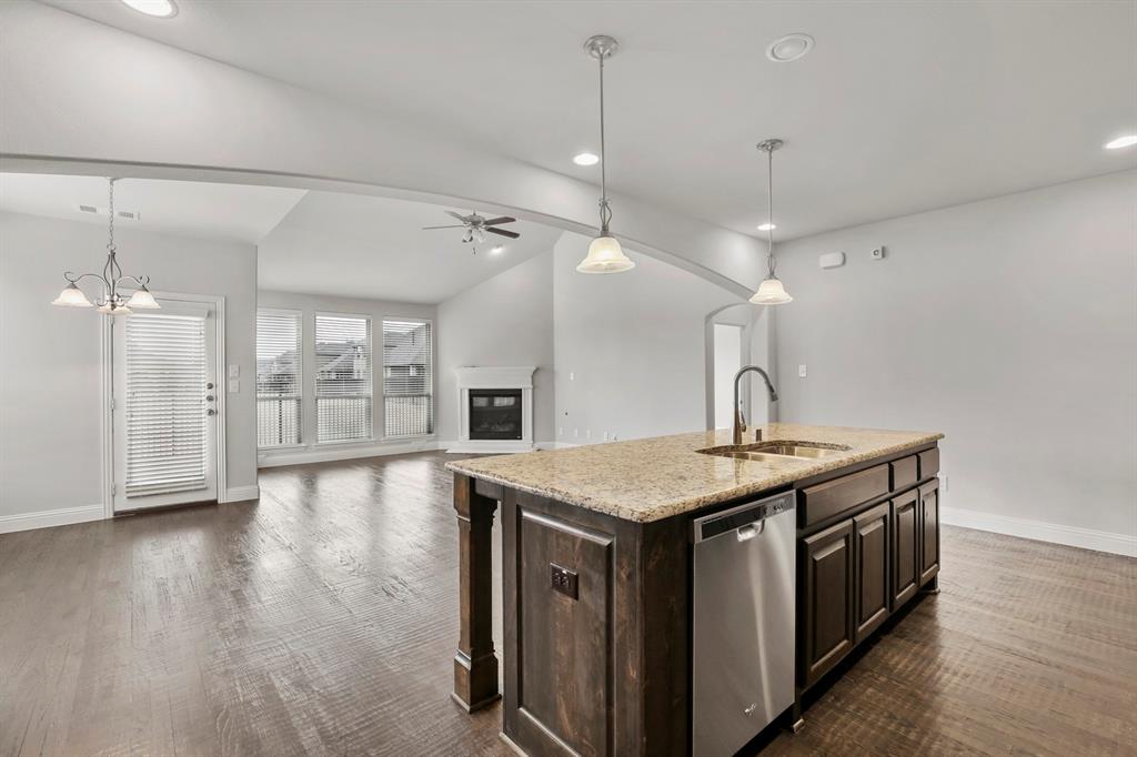 4333 Falcon Lane Carrollton, TX 75010 - Photo 11 of 35 a view of a kitchen counter space and wooden floor