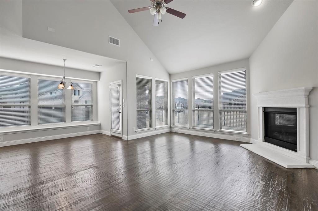 4333 Falcon Lane Carrollton, TX 75010 - Photo 14 of 35 a view of an empty room with wooden floor and a window