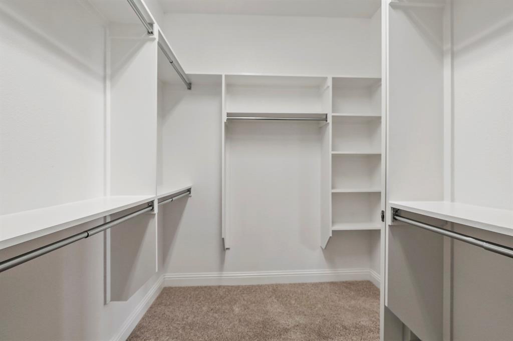 4333 Falcon Lane Carrollton, TX 75010 - Photo 20 of 35 a view of walk in closet with empty racks