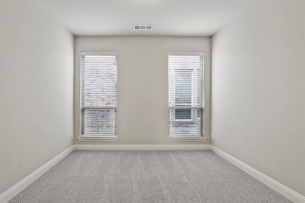 4333 Falcon Lane Carrollton, TX 75010 - Photo 22 of 35 an empty room with windows