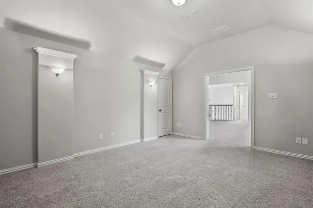 a view of an empty room and closet area