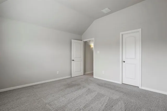 a view of an empty room and closet area
