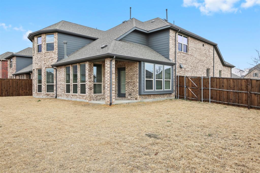 4333 Falcon Lane Carrollton, TX 75010 - Photo 34 of 35 a front view of a house with a yard