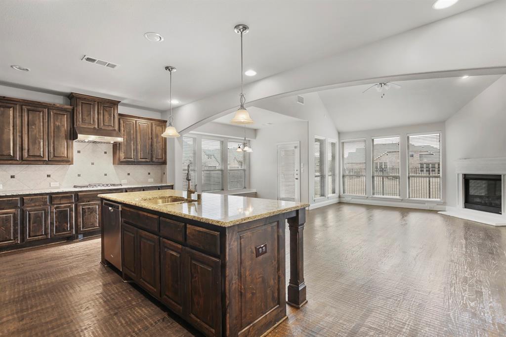 4333 Falcon Lane Carrollton, TX 75010 - Photo 9 of 35 a kitchen with a stove sink and cabinets