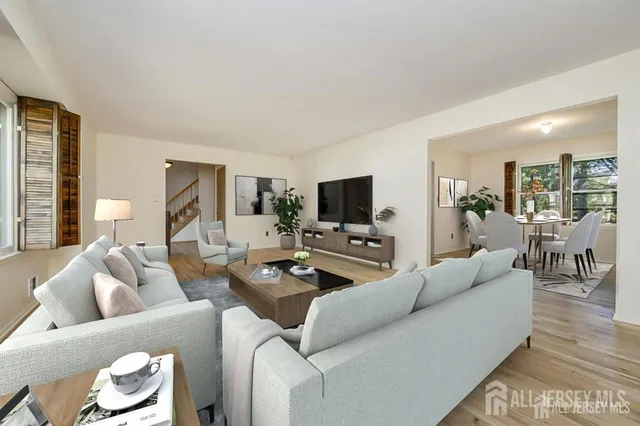a living room with furniture and a flat screen tv