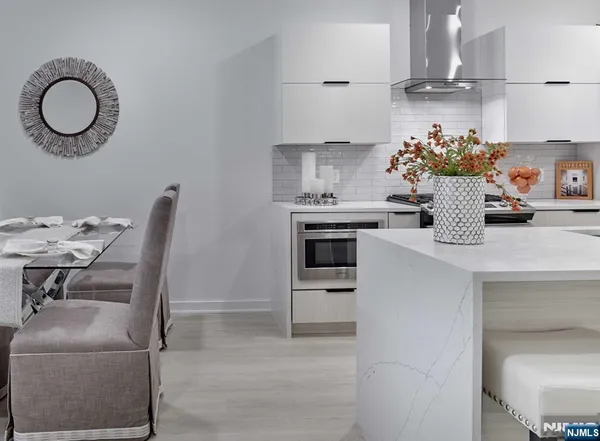 a kitchen with a sink cabinets and appliances