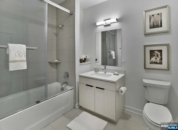 a bathroom with a toilet sink and bathtub
