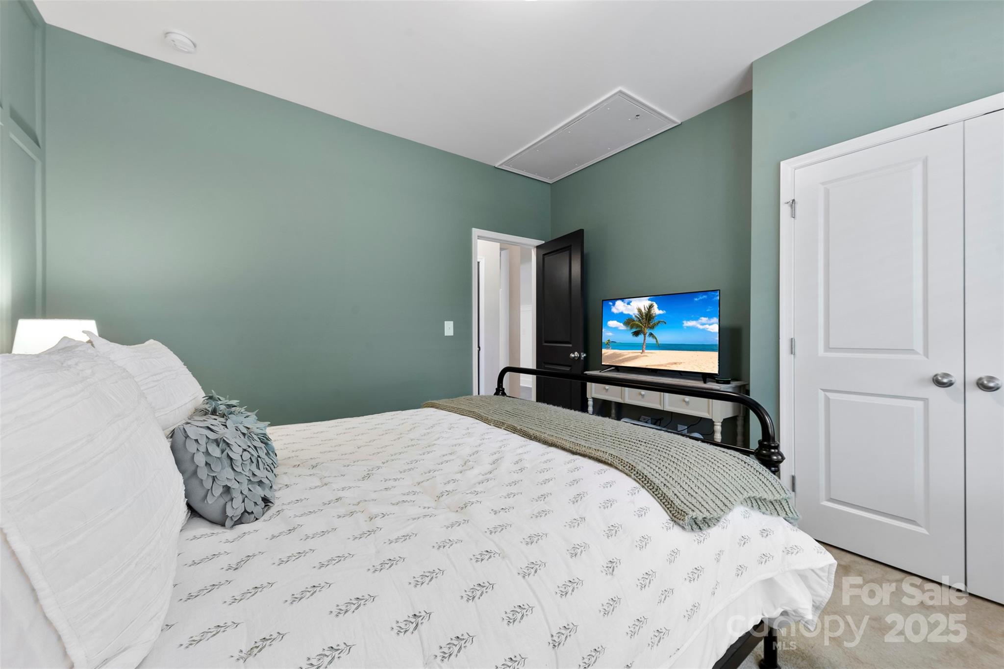 6261 Six String Court Fort Mill, SC 29708 - Photo 15 of 31 a bedroom with a bed and flat screen tv