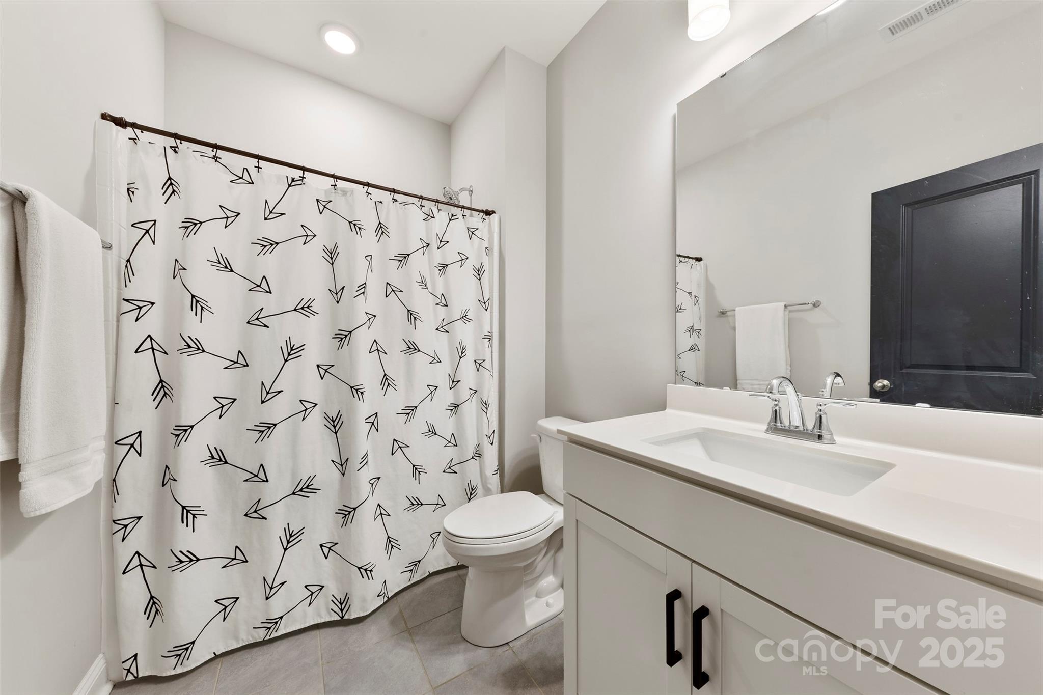 6261 Six String Court Fort Mill, SC 29708 - Photo 18 of 31 a bathroom with a sink toilet and shower