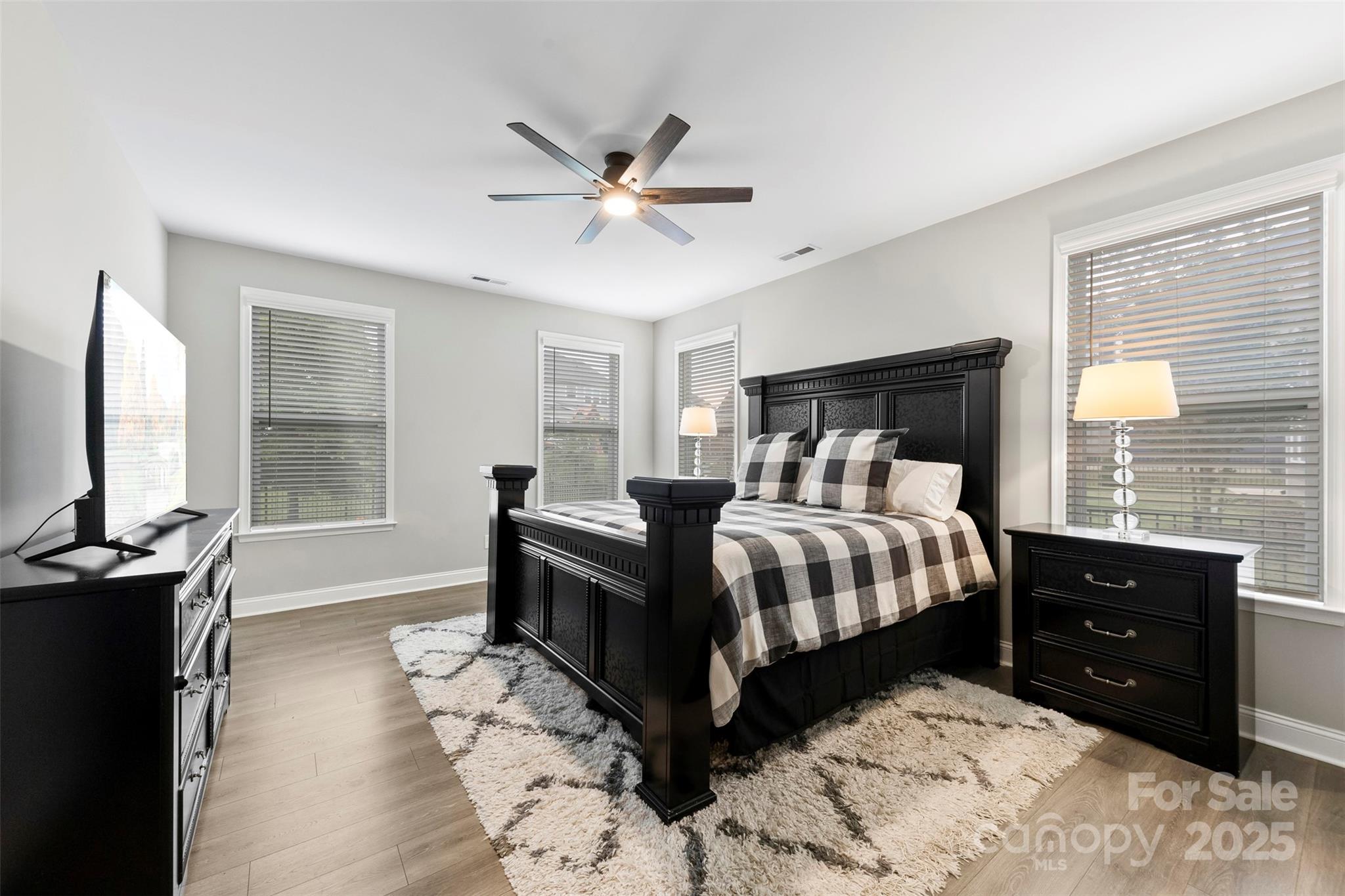 6261 Six String Court Fort Mill, SC 29708 - Photo 20 of 31 a bedroom with a bed window and a flat screen tv