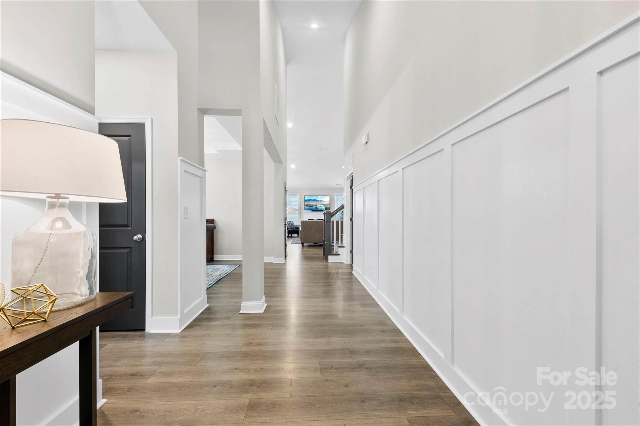 6261 Six String Court Fort Mill, SC 29708 - Photo 2 of 31 a view of a hallway view with wooden floor and staircase