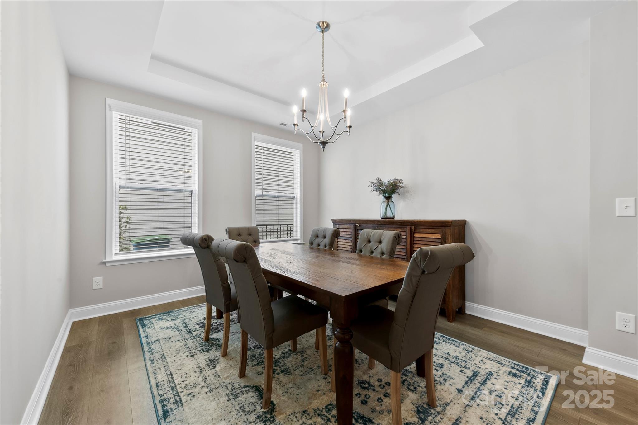 6261 Six String Court Fort Mill, SC 29708 - Photo 4 of 31 a view of a dining room with furniture window and wooden floor