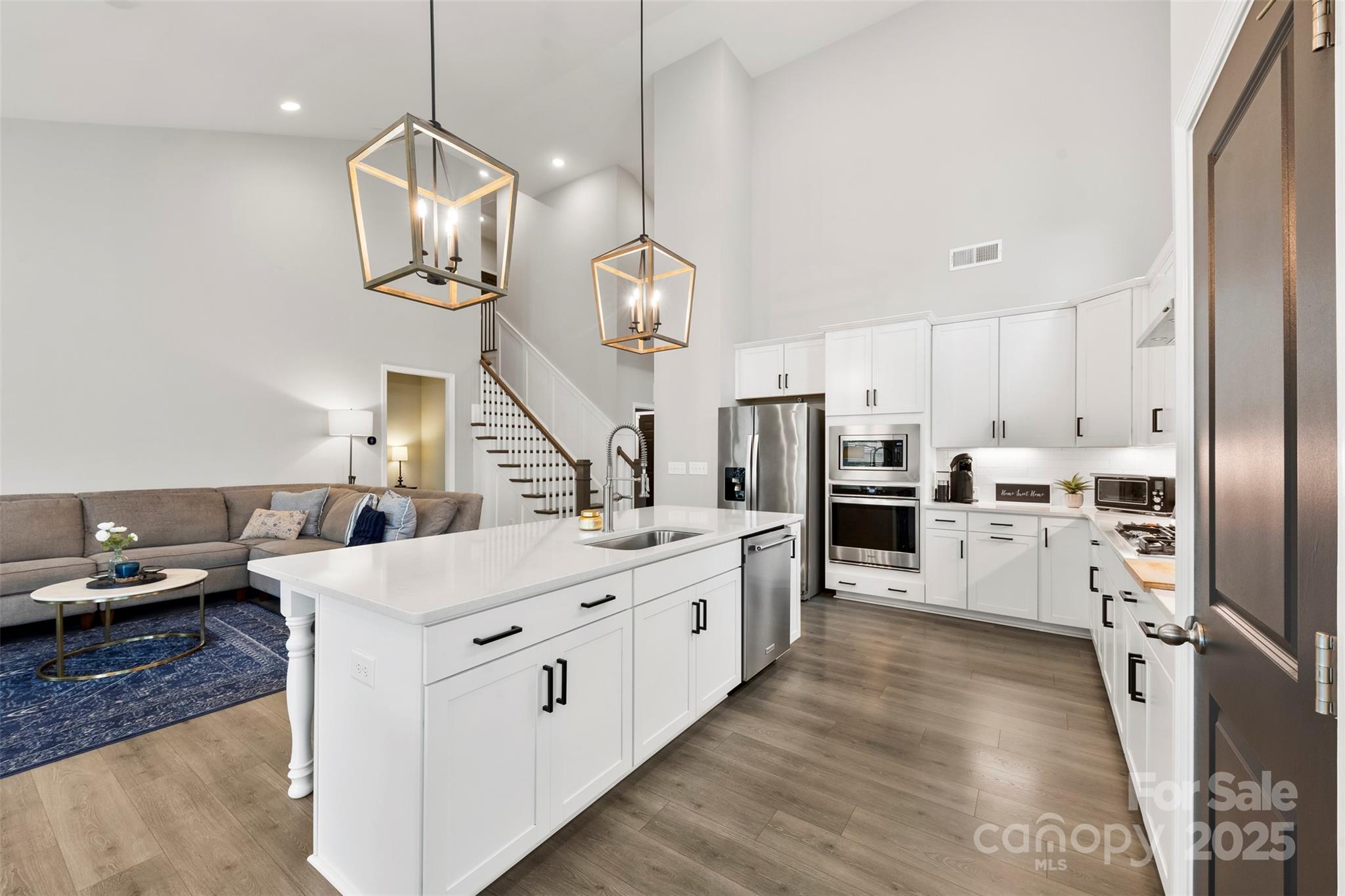 6261 Six String Court Fort Mill, SC 29708 - Photo 7 of 31 a large kitchen with white cabinets and stainless steel appliances