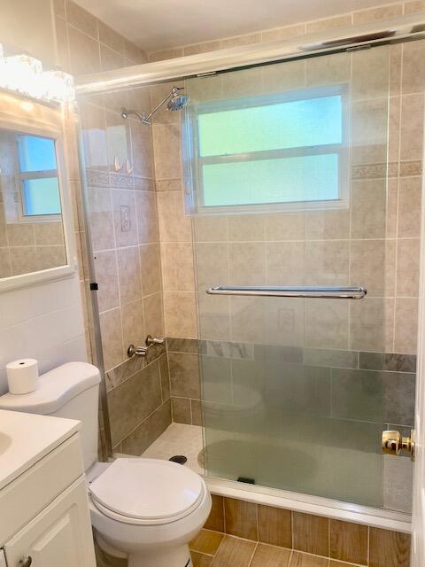312 North 27th Street Fort Pierce, FL 34947 - Photo 2 of 10 a bathroom with a shower a toilet and a sink