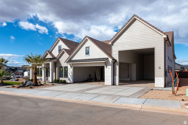 4961 Ripple Road Washington, UT 84780 - Photo 2 of 11 View of front of property featuring concrete driveway and a standing seam roof