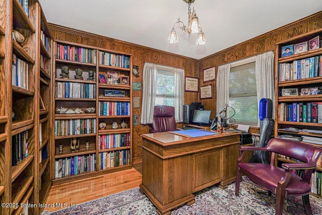 a view of a workspace with bookshelf