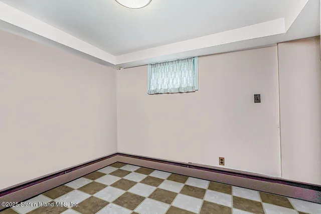 a picture of a bench in front of a window