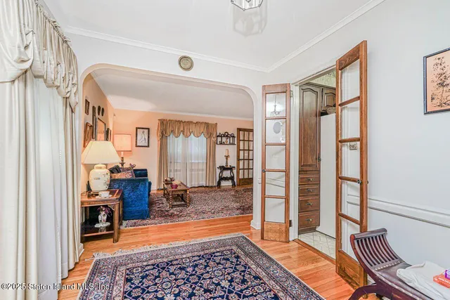 a kitchen that has a sink cabinets and stainless steel appliances