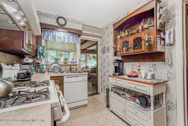 a living room with furniture a flat screen tv and a large window