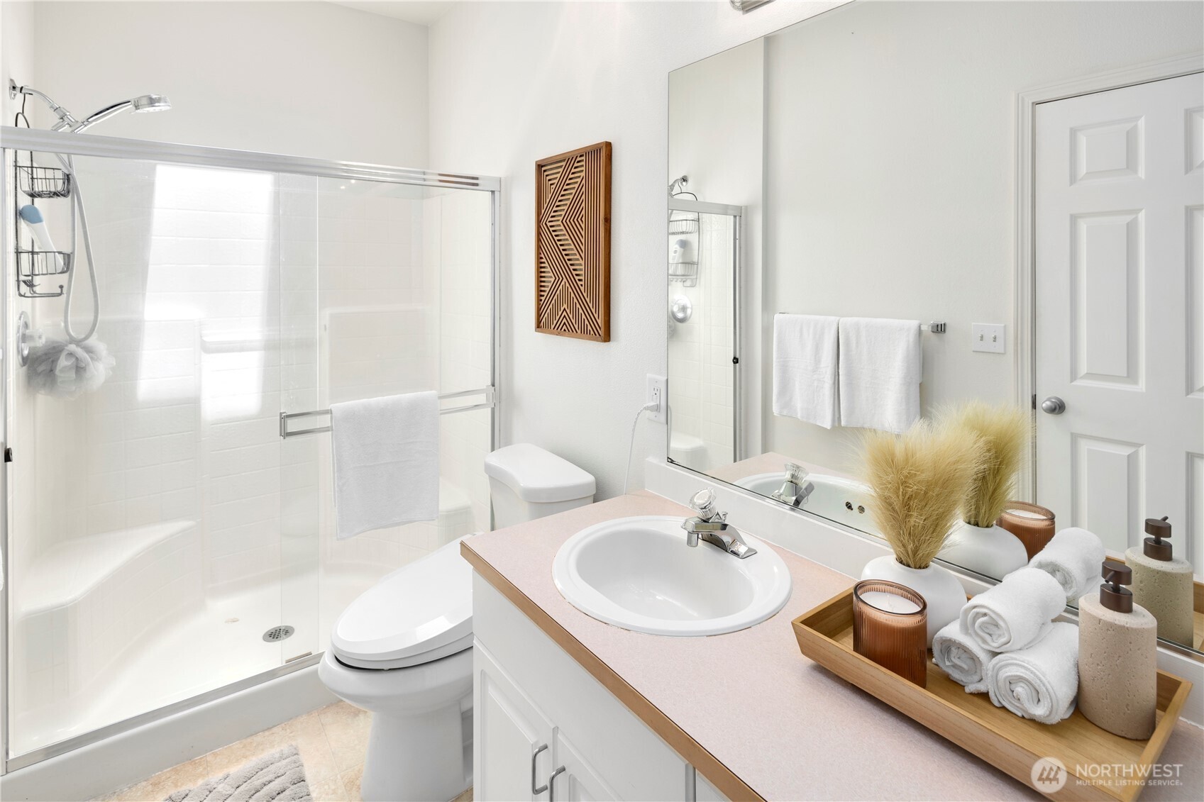 14120 Southeast 171st Way, Unit C303 Renton, WA 98058 - Photo 17 of 21 a bathroom with a sink and a mirror