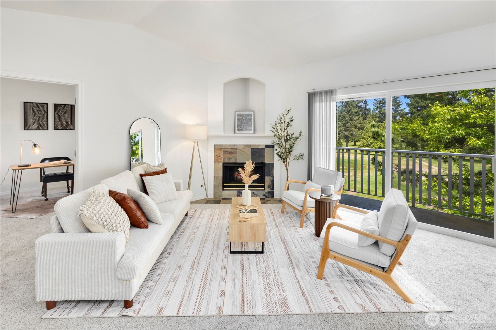 14120 Southeast 171st Way, Unit C303 Renton, WA 98058 - Photo 4 of 21 a living room with furniture fireplace and a large window