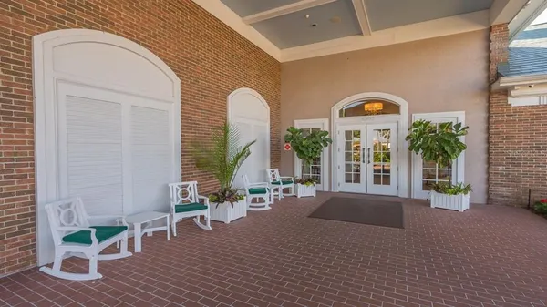 a view of a patio with a table and chairs