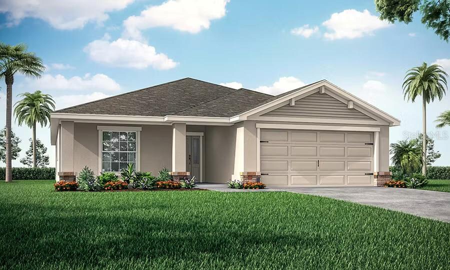 7038 162nd Place East Parrish, FL 34219 - Photo 1 of 4 a front view of a house with a garden and plants