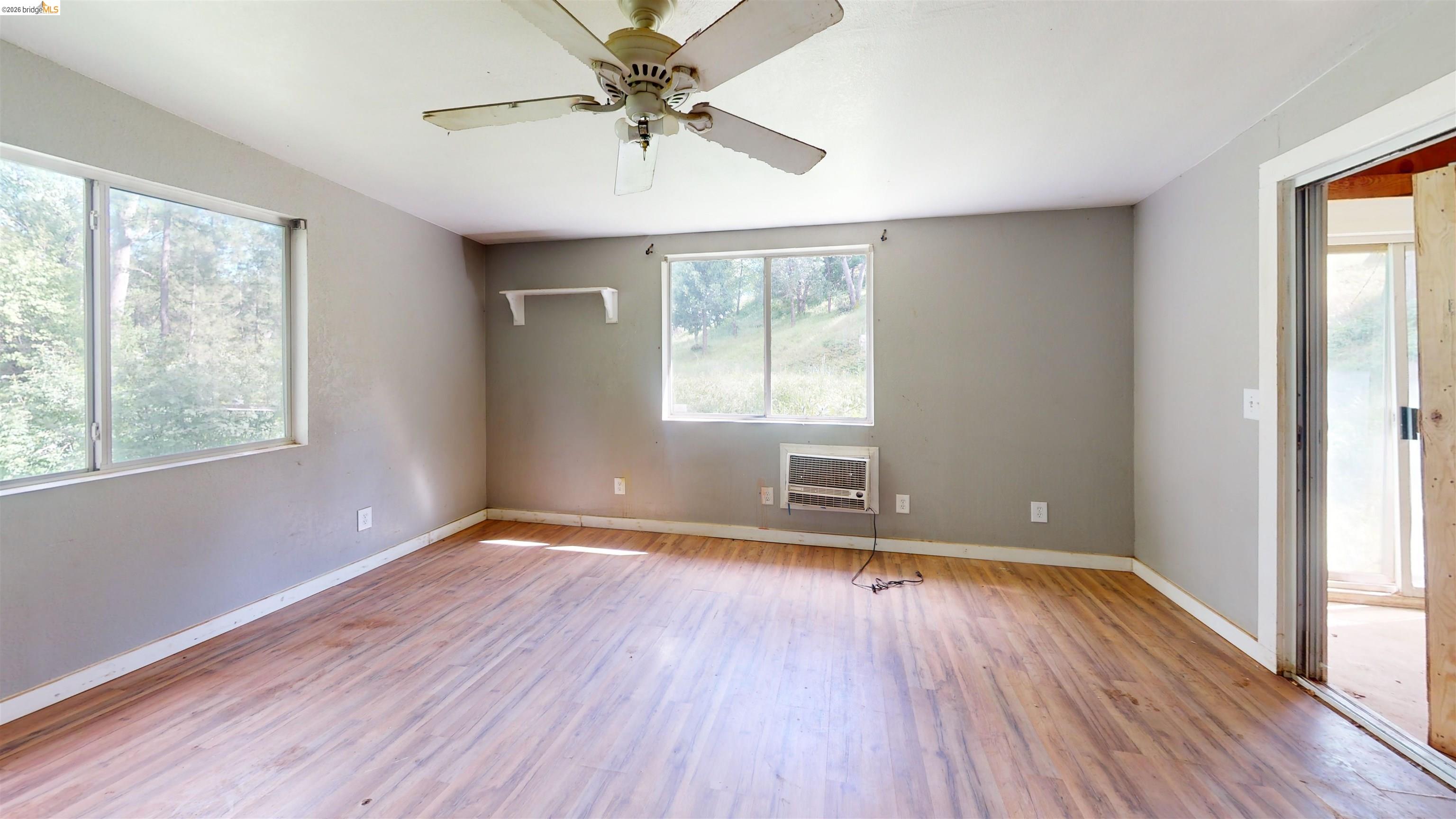 20231 Hidden Acres Road Sonora, CA 95370 - Photo 20 of 25 Spacious room featuring wood-finish flooring and neutral wall tones