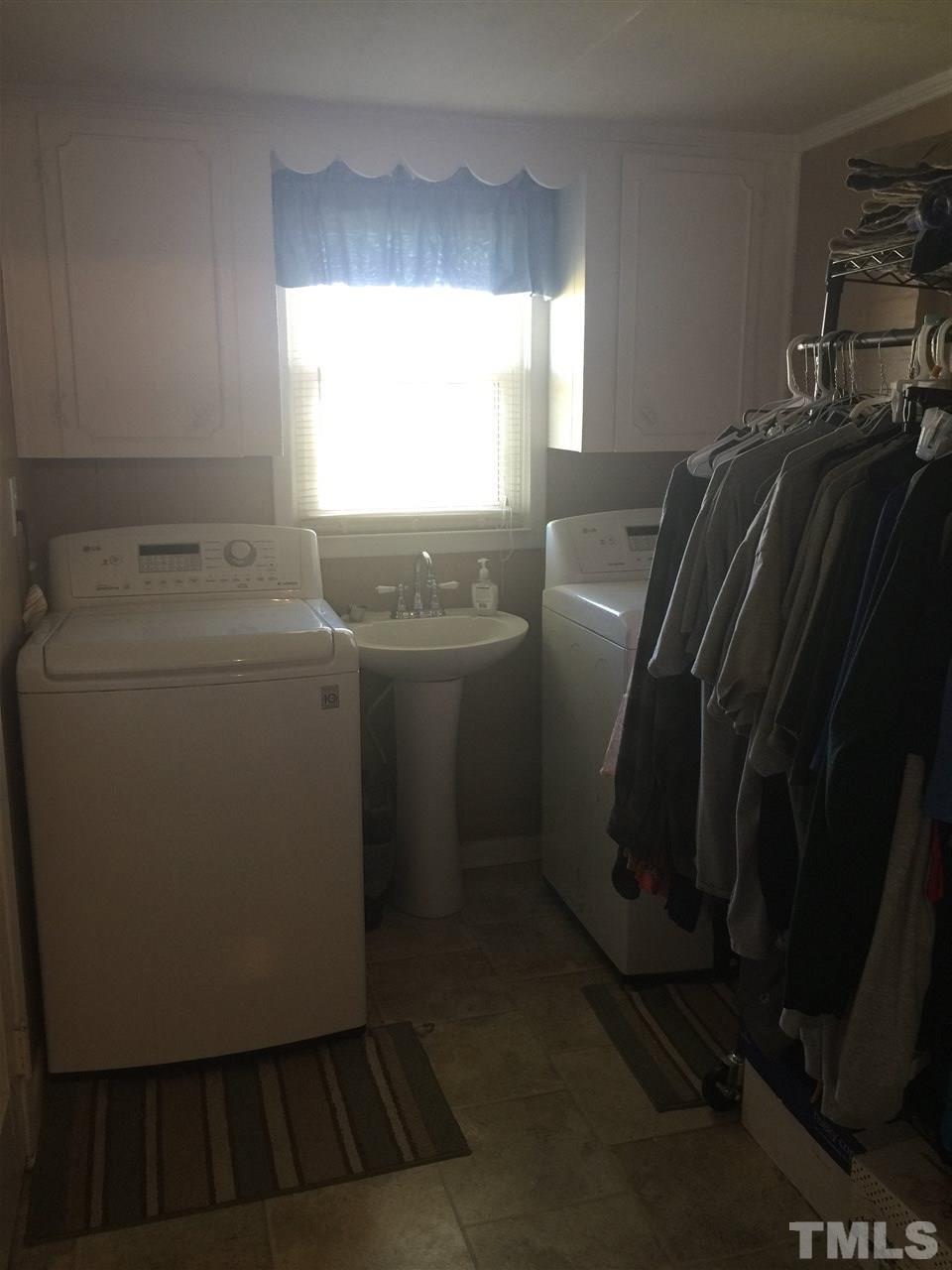 754 Drag Strip Road Benson, NC 27504 - Photo 16 of 16 a utility room with dryer and washer