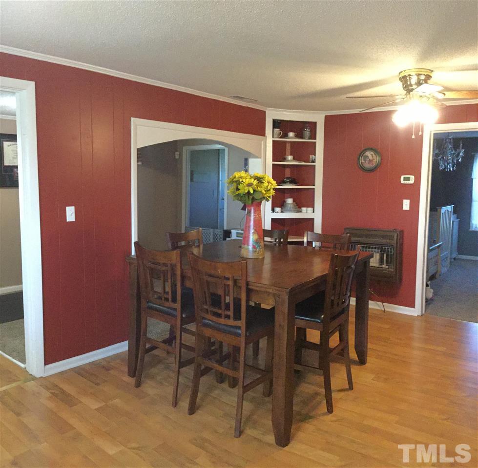 754 Drag Strip Road Benson, NC 27504 - Photo 7 of 16 a view of a dining room with furniture