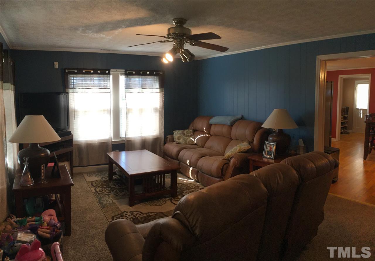 754 Drag Strip Road Benson, NC 27504 - Photo 9 of 16 a living room with furniture and a window
