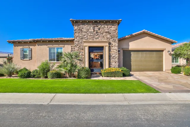 a view of front door and yard