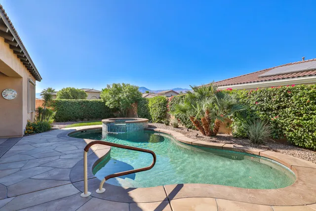 a backyard of a house with outdoor seating