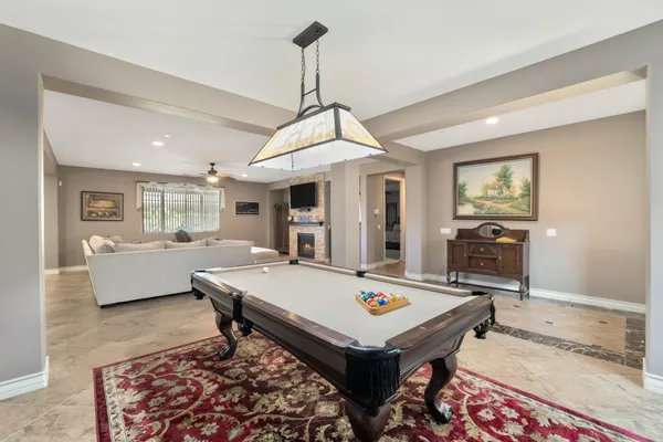 a living room with dining table and couches