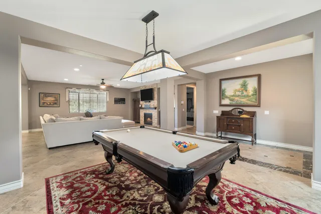 a living room with dining table and couches