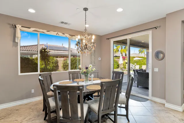 a view of a dining room with furniture window and outside view
