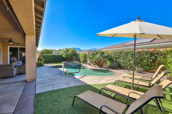 a view of yard with patio