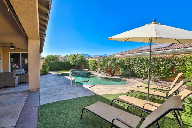 a view of yard with patio