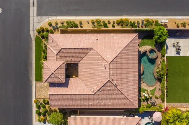 an aerial view of residential houses and outdoor space