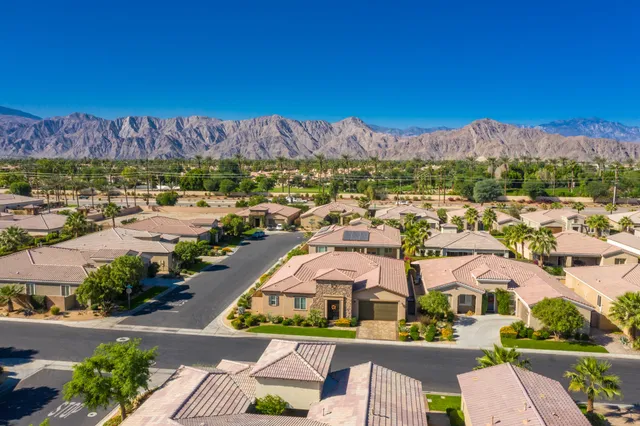 a view of a swimming pool with an outdoor seating and a yard