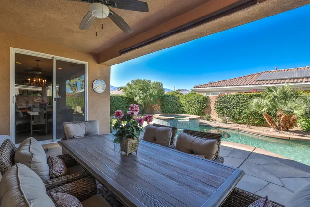 a outdoor living space with furniture and a potted plant