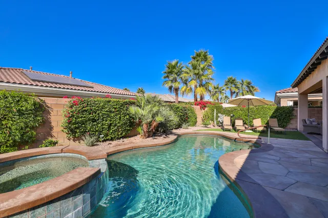 a view of a swimming pool with a patio