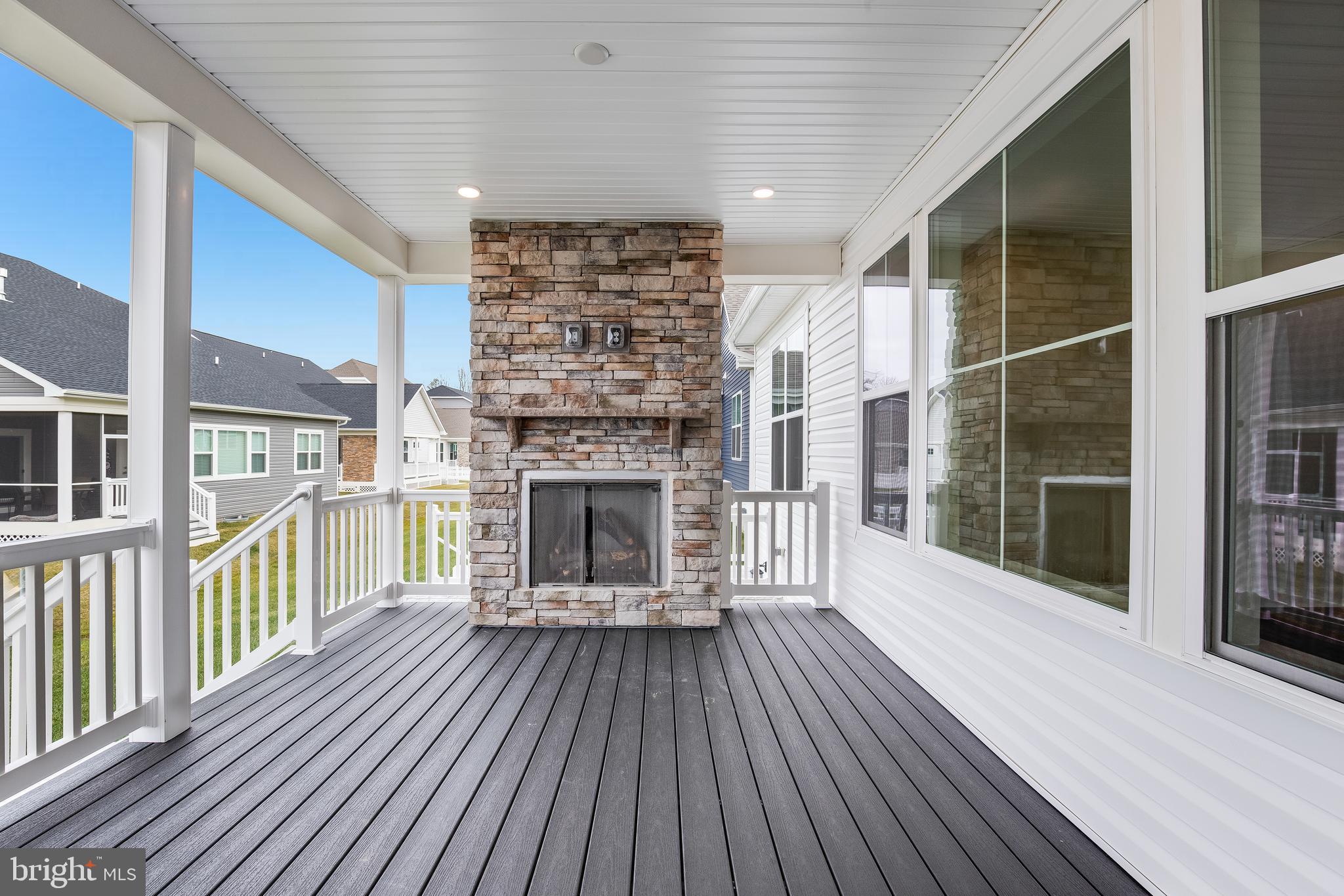 209 Mariners Circle Milton, DE 19968 - Photo 22 of 33 back porch with gas fireplace