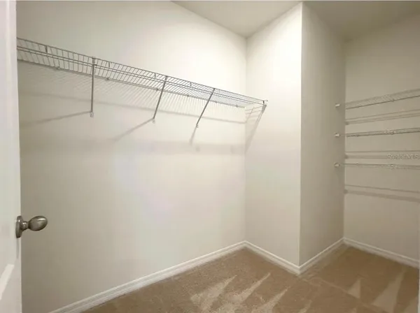a view of a room with racks on the wall