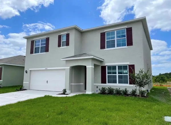 a big house with a big yard and more windows