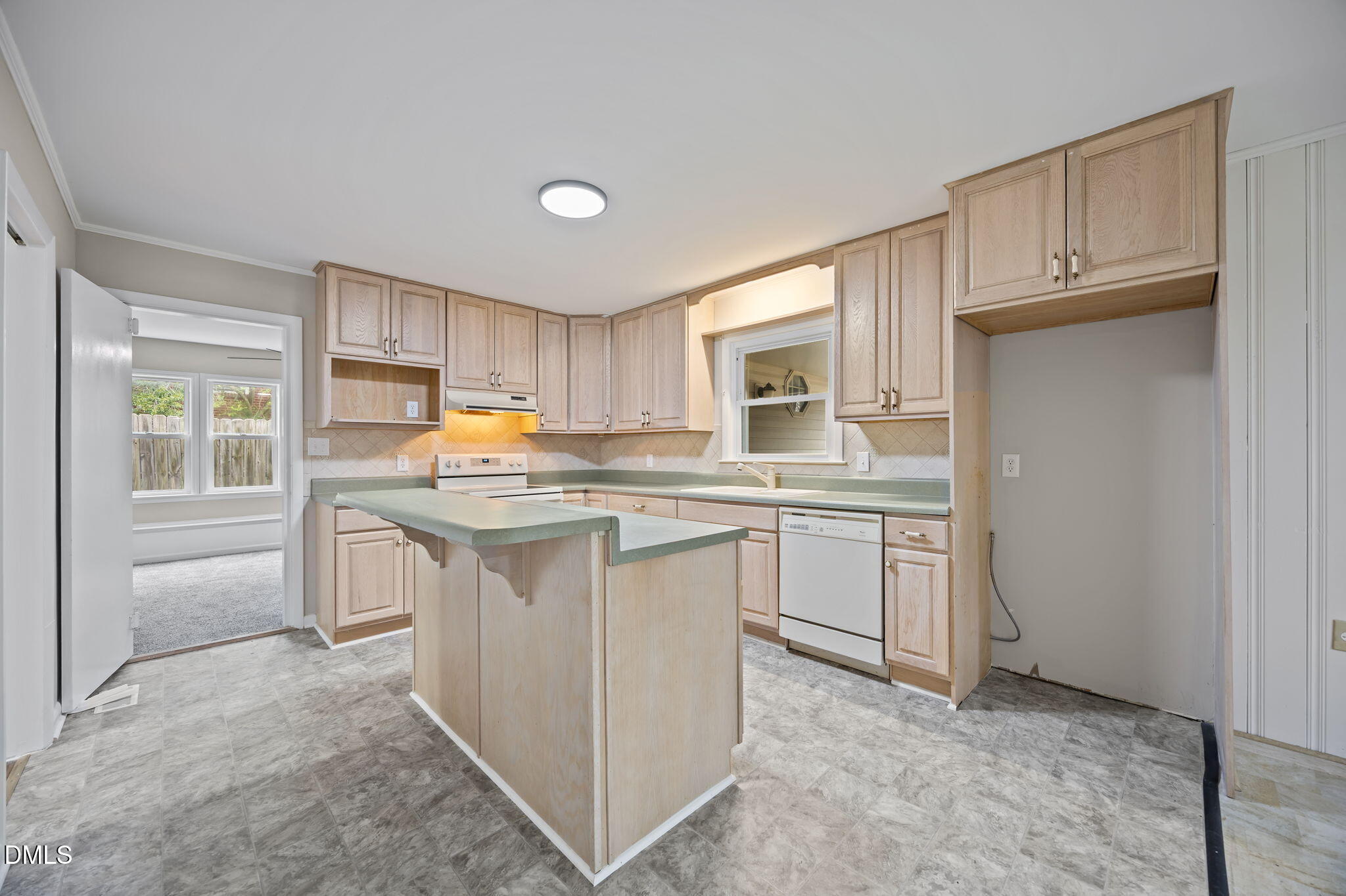637 Buck Jones Road Raleigh, NC 27606 - Photo 14 of 32 a kitchen with white cabinets and white appliances